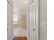 Ensuite bathroom featuring a soaking tub with an arched window and a separate tiled shower at 13375 Newcastle Ave, Spring Hill, FL 34609