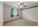 Cozy bedroom with light coming in from a nearby window at 13375 Newcastle Ave, Spring Hill, FL 34609