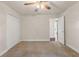 Neutral bedroom with a ceiling fan, closet, and natural light at 13375 Newcastle Ave, Spring Hill, FL 34609