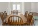 Dining room featuring a wood table set and front door view at 13375 Newcastle Ave, Spring Hill, FL 34609