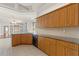 Well-equipped kitchen with granite countertops and wooden cabinets at 13375 Newcastle Ave, Spring Hill, FL 34609