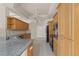 Traditional kitchen with wood cabinetry, granite counters, and stainless appliances at 13375 Newcastle Ave, Spring Hill, FL 34609