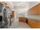 Spacious open kitchen with stainless appliances and tile flooring at 13375 Newcastle Ave, Spring Hill, FL 34609