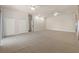 Large living room with neutral carpet, ceiling fans and multiple closets at 13375 Newcastle Ave, Spring Hill, FL 34609