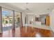 Beautiful living room with hardwood floors and sliding glass doors to patio at 13375 Newcastle Ave, Spring Hill, FL 34609