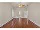 Generous main bedroom features hardwood floors, ensuite bathroom access, and ample natural lighting at 13375 Newcastle Ave, Spring Hill, FL 34609
