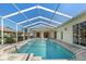 Backyard pool with outdoor patio and screen enclosure with direct house access at 13375 Newcastle Ave, Spring Hill, FL 34609