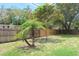 Backyard with a wood fence and green grass at 1344 S Michigan Ave, Clearwater, FL 33756