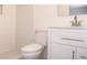 Updated bathroom with modern vanity, stylish fixtures, and a tiled shower with glass door at 1344 S Michigan Ave, Clearwater, FL 33756