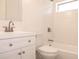 Renovated bathroom with modern fixtures, new white tiles, and a shower/tub combo at 1344 S Michigan Ave, Clearwater, FL 33756