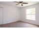 Cozy bedroom with carpet, natural light from a window, and closet at 1344 S Michigan Ave, Clearwater, FL 33756