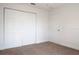 Clean bedroom featuring neutral carpet and ample closet space at 1344 S Michigan Ave, Clearwater, FL 33756