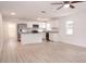Modern kitchen with stainless steel appliances, granite countertops, white cabinets, and an island at 1344 S Michigan Ave, Clearwater, FL 33756