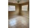 Neutral bedroom with tiled flooring, ceiling fan and two windows providing ample light at 1427 15Th S St, St Petersburg, FL 33705
