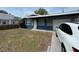 Charming single-story home with a well-maintained front yard and a private driveway at 1427 15Th S St, St Petersburg, FL 33705