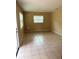 Living room featuring neutral walls, tiled flooring, and natural lighting at 1427 15Th S St, St Petersburg, FL 33705