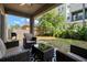 Inviting covered back patio featuring comfortable seating and a well-maintained yard at 1520 W Fig St, Tampa, FL 33606