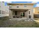 Backyard with a covered patio, outdoor seating, and a grill at 1520 W Fig St, Tampa, FL 33606