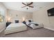 Spacious bedroom featuring two beds, matching nightstands, and plush carpet floors at 1520 W Fig St, Tampa, FL 33606