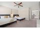 Bedroom with two beds, a ceiling fan, and carpet floors at 1520 W Fig St, Tampa, FL 33606