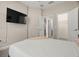 Bedroom featuring a TV, closet, and doorway to the ensuite bathroom at 1520 W Fig St, Tampa, FL 33606
