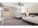 Bedroom with two beds, a ceiling fan, and carpet floors at 1520 W Fig St, Tampa, FL 33606