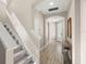 Hallway with wooden floors, and stairs to the left at 1520 W Fig St, Tampa, FL 33606