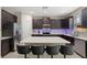 Modern kitchen featuring a large center island with bar seating, and stainless steel appliances at 1520 W Fig St, Tampa, FL 33606