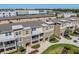 Aerial view showcasing modern townhomes with balconies and well-maintained landscaping at 1543 W Cass St, Tampa, FL 33606