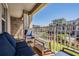 Cozy balcony featuring comfortable seating and a view of the community gardens at 1543 W Cass St, Tampa, FL 33606