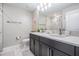 Bathroom with a double vanity, modern fixtures, and sleek marble countertops at 1543 W Cass St, Tampa, FL 33606
