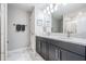 Modern bathroom with double vanity sinks, marble countertops and modern fixtures at 1543 W Cass St, Tampa, FL 33606