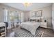 Bright bedroom with natural light, stylish decor, and a large mirror at 1543 W Cass St, Tampa, FL 33606