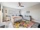 Comfortable bedroom featuring a ceiling fan, natural light, and stylish floral rug at 1543 W Cass St, Tampa, FL 33606
