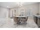 Well-lit dining area featuring a modern table set and marble floors at 1543 W Cass St, Tampa, FL 33606