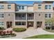 Charming townhouse with brick accents, dual balconies and well-maintained landscaping at 1543 W Cass St, Tampa, FL 33606