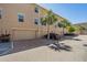 Townhome exterior featuring tan stucco, garages, and brick paved driveways and palm trees at 1543 W Cass St, Tampa, FL 33606