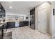 Spacious kitchen with stainless steel refrigerator and an open floor plan into the living area at 1543 W Cass St, Tampa, FL 33606