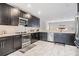 Well-equipped kitchen with stainless steel appliances and elegant marble floors at 1543 W Cass St, Tampa, FL 33606