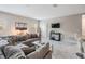 Spacious living room featuring modern gray couch, tv, marble floors and stylish decor at 1543 W Cass St, Tampa, FL 33606