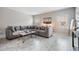 Bright living room with large grey couch, marble floors and modern decor at 1543 W Cass St, Tampa, FL 33606