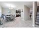 Open living space with dining room, staircase and direct view into the kitchen at 1543 W Cass St, Tampa, FL 33606