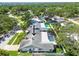 Aerial view featuring a home with a large screened-in pool, patio furniture, and fenced backyard at 1622 El Tair Trl, Clearwater, FL 33765