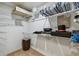 Walk-in closet with wire shelving for organizing clothing and accessories at 1622 El Tair Trl, Clearwater, FL 33765