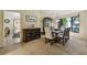 Bright dining room with seating for six, dark wood accents and modern decor at 1622 El Tair Trl, Clearwater, FL 33765