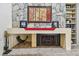 Close up on a stone fireplace with built in shelves at 1622 El Tair Trl, Clearwater, FL 33765