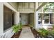 Inviting front entrance with decorative double doors and surrounding greenery at 1622 El Tair Trl, Clearwater, FL 33765