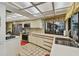 Light-filled kitchen with stainless steel appliances, tile backsplash, plenty of cabinets, and lots of counter space at 1622 El Tair Trl, Clearwater, FL 33765