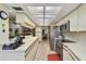Spacious kitchen featuring stainless steel appliances, ample counter space, and an open design for easy entertaining at 1622 El Tair Trl, Clearwater, FL 33765