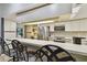 Modern kitchen features stainless steel appliances, ample counter space, and convenient breakfast bar seating at 1622 El Tair Trl, Clearwater, FL 33765